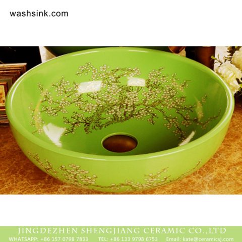 Wintersweet Series Elegant single hole Jingdezhen made Japanese style art quaint round bathroom ceramic table top sink with scattered plum blossom pattern on green glaze wall and surface XHTC-X-1055-1