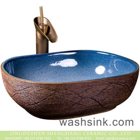 Jingdezhen Chinese antique retro style ceramic countertop sink with high gloss light blue wall and carved big wave stripes on imitating wood surface XXDD-36-3