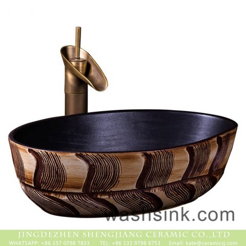 Made in China thin edge oval Chinese style ceramic countertop art basin domestic bathroom wash bowl with black wall and wood color hand carved design pattern XXDD-44-1